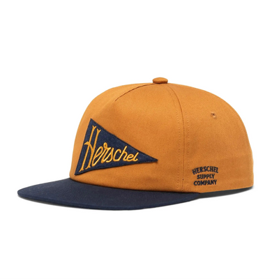 orange herschel supply co hat with navy bill and navy pennant with gold herschel in script