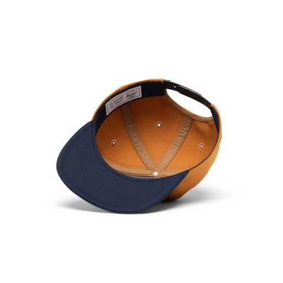 orange herschel supply co hat with navy bill and navy pennant with gold herschel in script