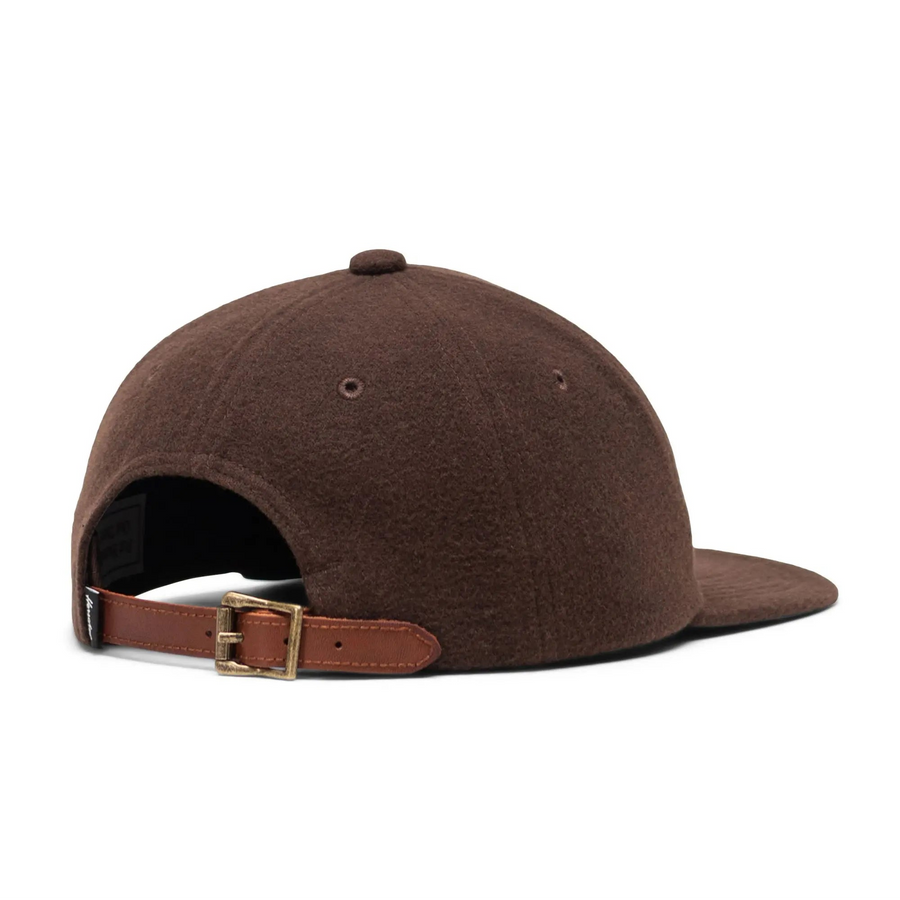 brown herschel supply co vintage ranger hat with green tree on a white background with white H in the center