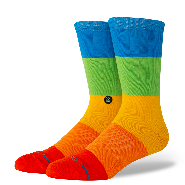 Colorful stance socks with blue, green, orange, and red design on a white background