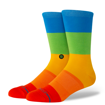 Colorful stance socks with blue, green, orange, and red design on a white background