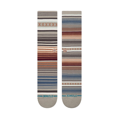 Two striped stance curren st crew socks with a pattern on a white background