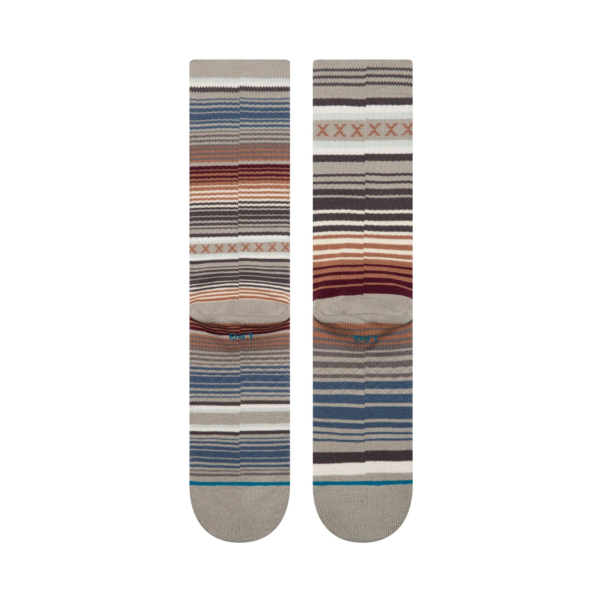 Two striped stance curren st crew socks with a pattern on a white background
