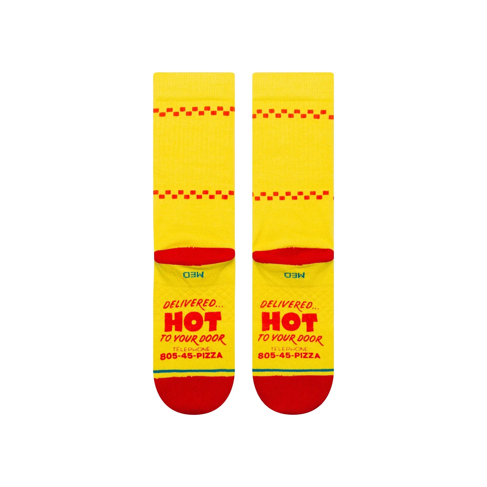 Yellow stance x stranger things surfer boy pizza crew socks with red heels and toes. On the bottom of the foot it says, "Delivered... Hot to your door"