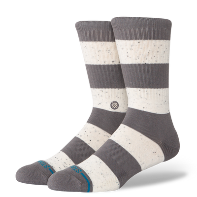 Pair of gray and white stance nep striped socks on a white background
