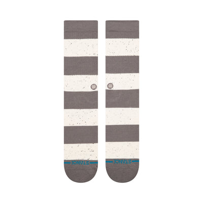 Pair of gray and white stance nep striped socks on a white background