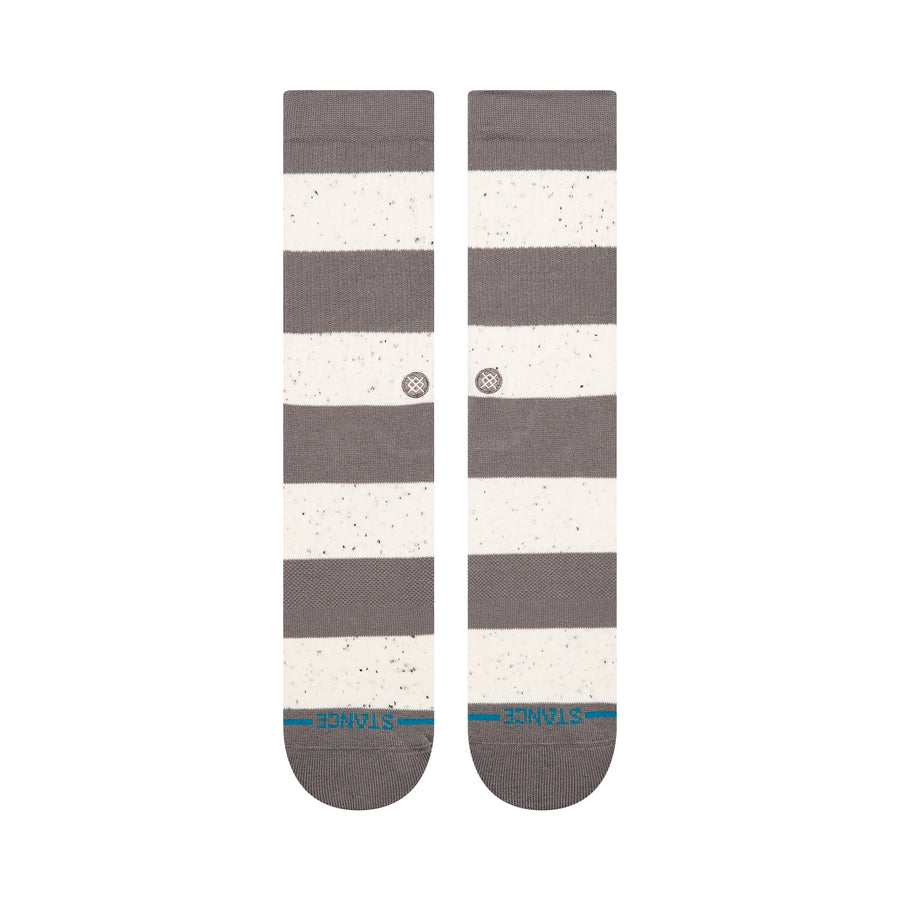 Pair of gray and white stance nep striped socks on a white background