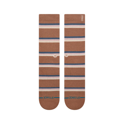 Pair of brown striped stance butter blend socks with a visible brand logo on a white background