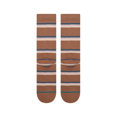 Pair of brown striped stance butter blend socks with a visible brand logo on a white background