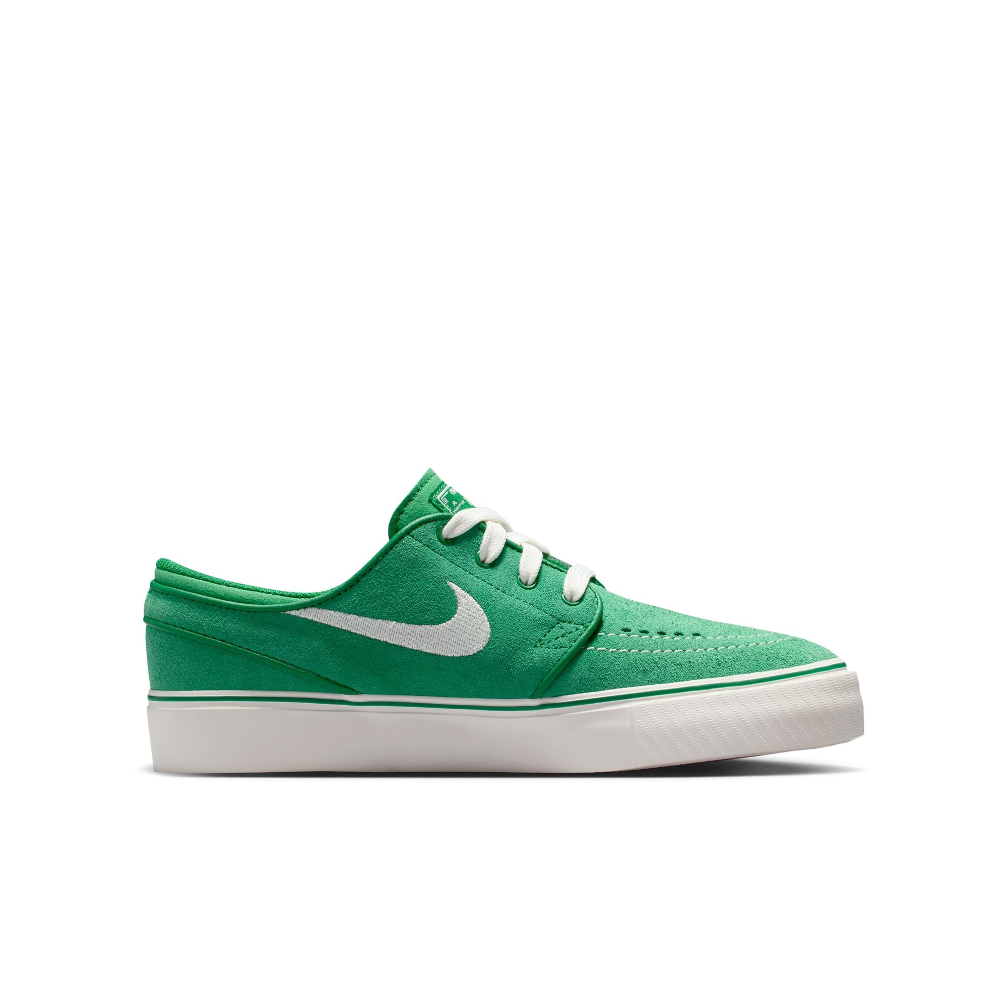 Green big kids janoski sneaker with white Nike logo on a white background