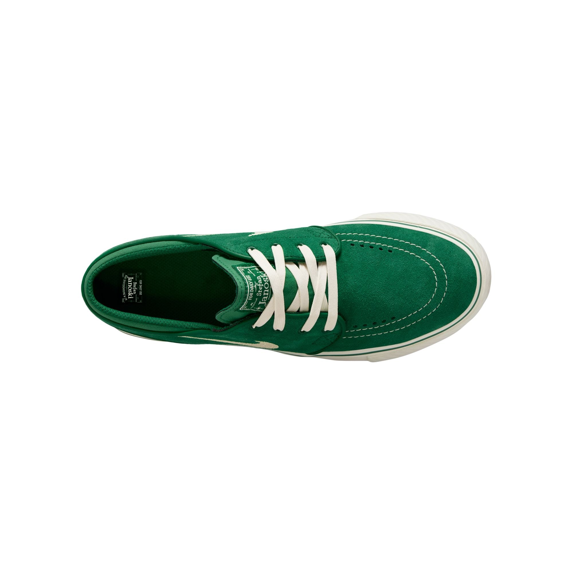 Green big kids janoski sneaker with white Nike logo on a white background
