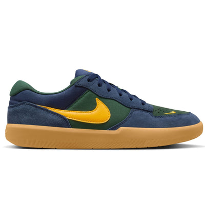 navy blue and green nike sb force 58 men's skateboard shoe with golden yellow nike swoosh and gum sole