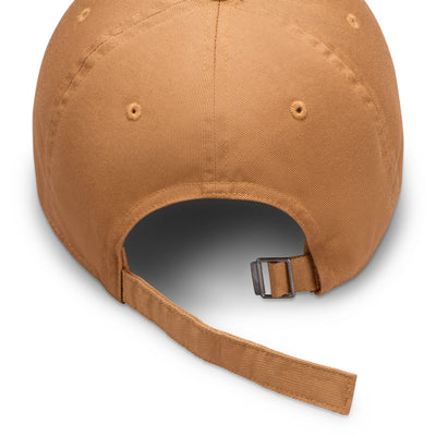 brown nike hat with white nike logo