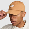 brown nike hat with white nike logo