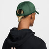 green nike dad hat with white logo