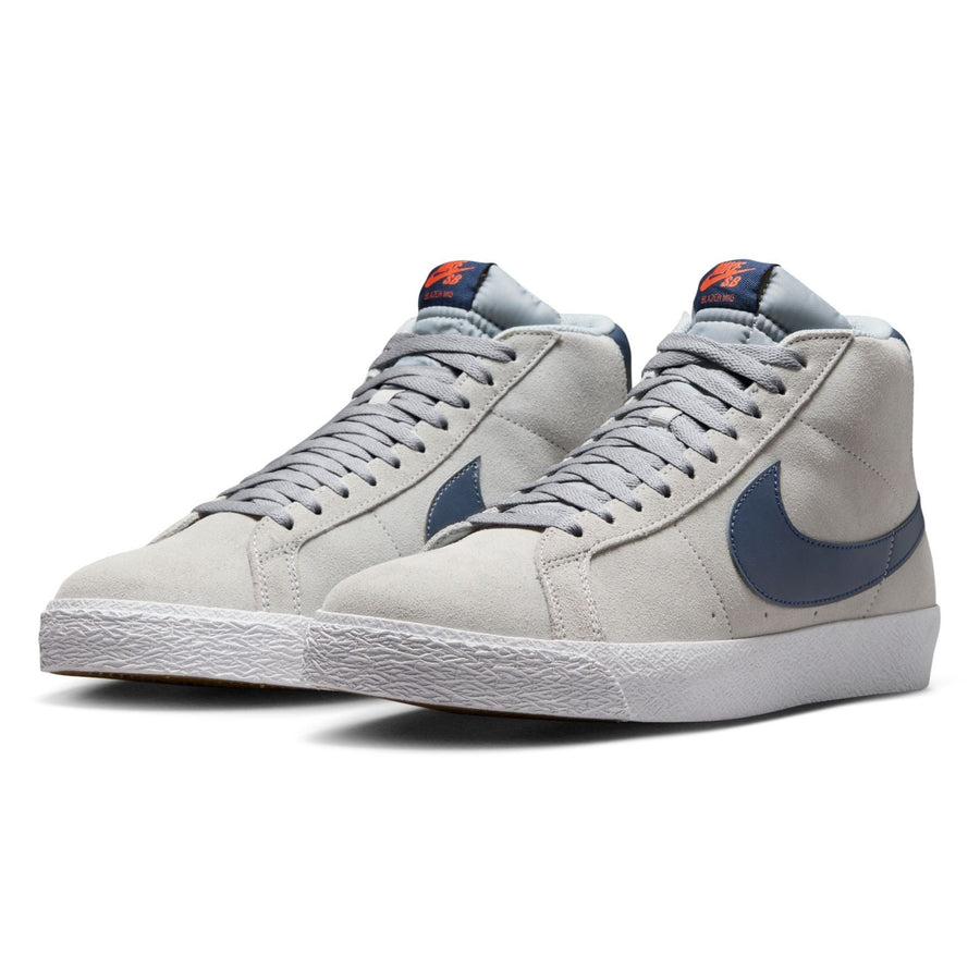 grey mid top nike sb blazer with blue nike swoosh and orange detail and white sole