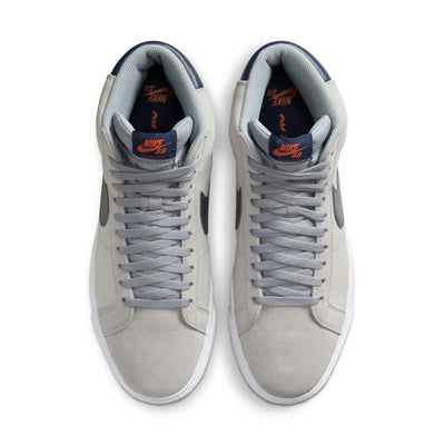 grey mid top nike sb blazer with blue nike swoosh and orange detail and white sole