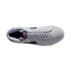 grey mid top nike sb blazer with blue nike swoosh and orange detail and white sole