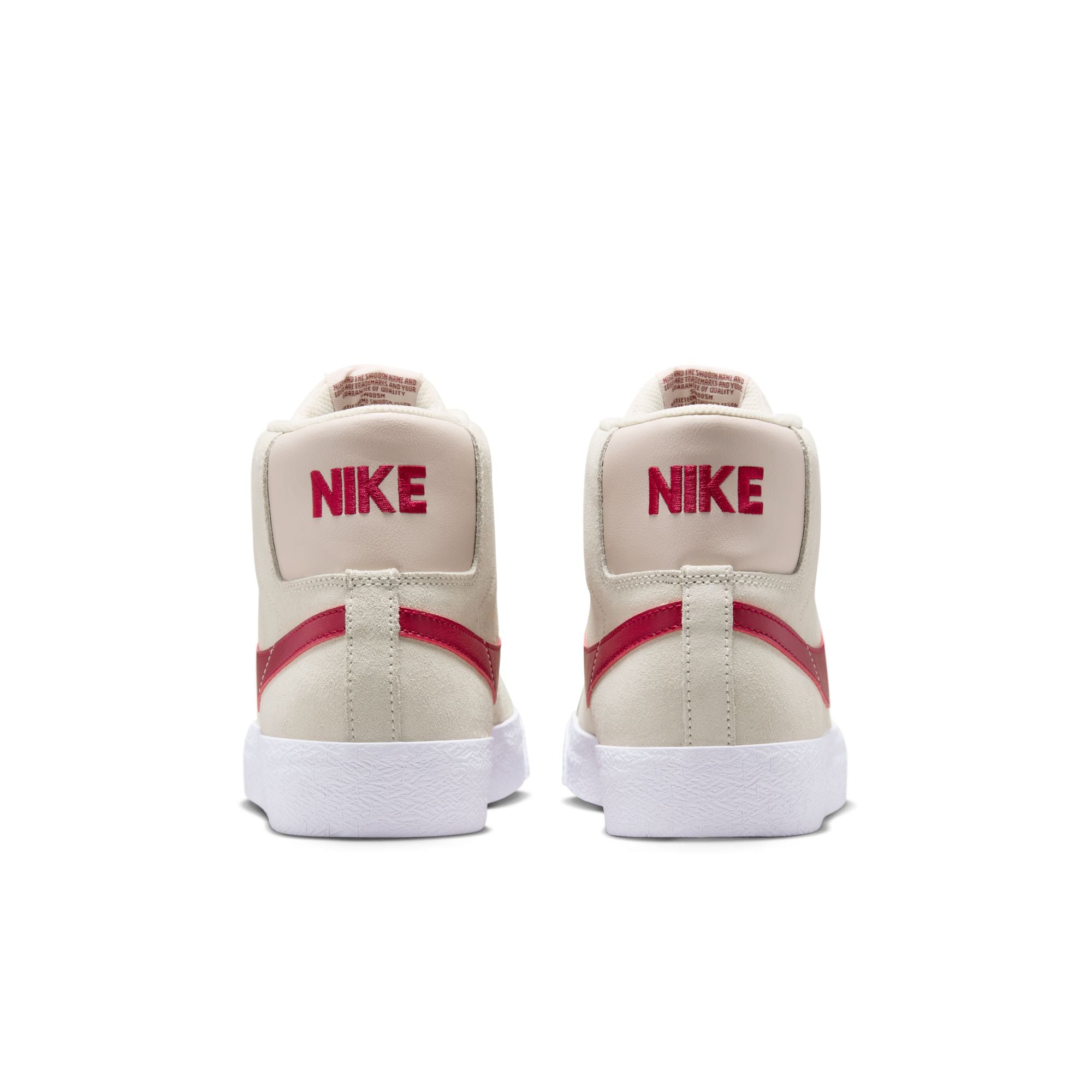 Beige nike sb blazer mid skateboard sneaker with red swoosh logo on a white background
