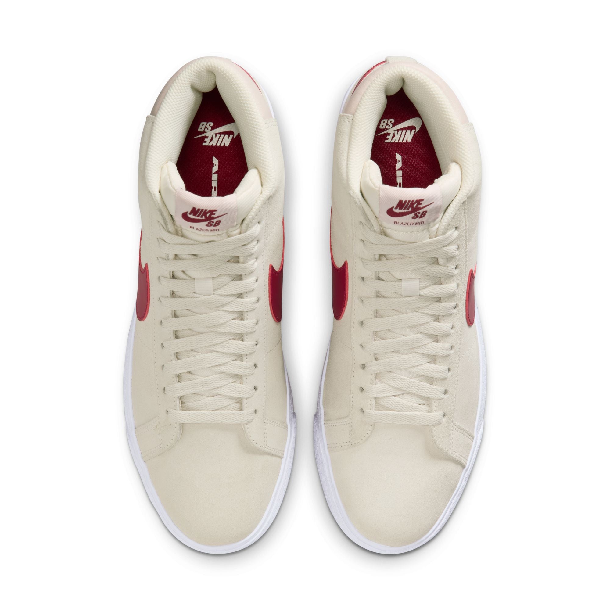 Beige nike sb blazer mid skateboard sneaker with red swoosh logo on a white background