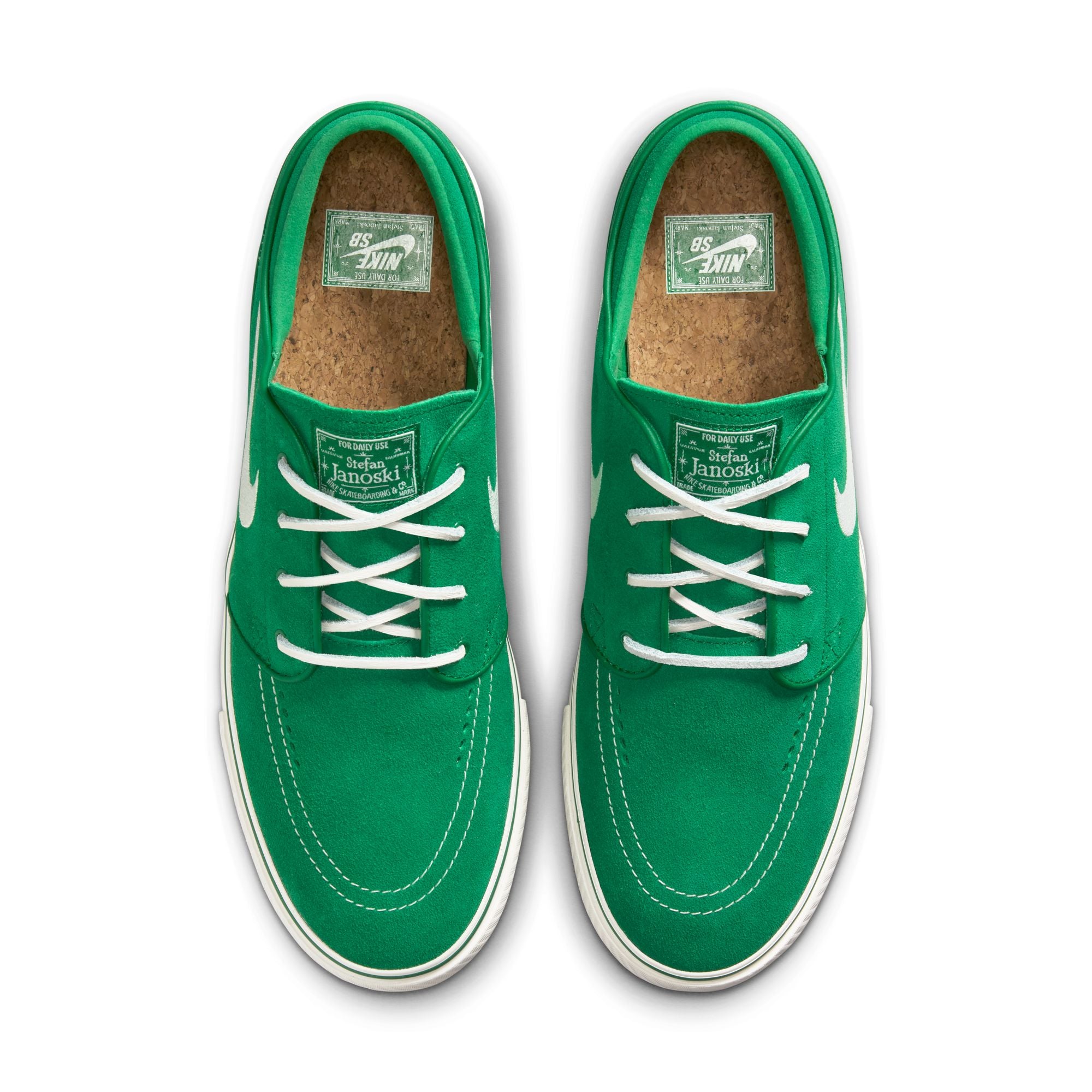 Green nike sb janoski skateboard sneaker with white swoosh logo on a white background