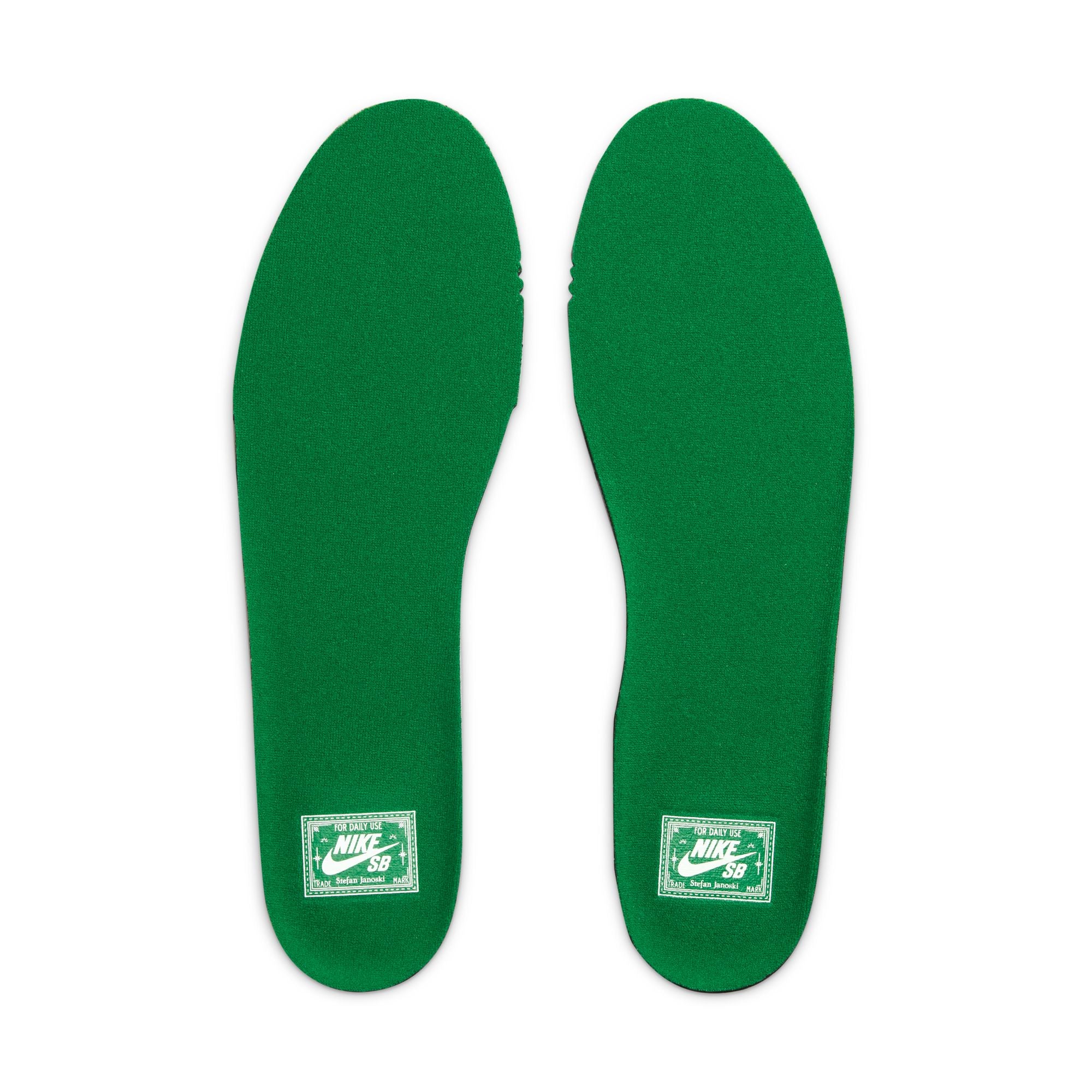 Green nike sb janoski skateboard sneaker with white swoosh logo on a white background