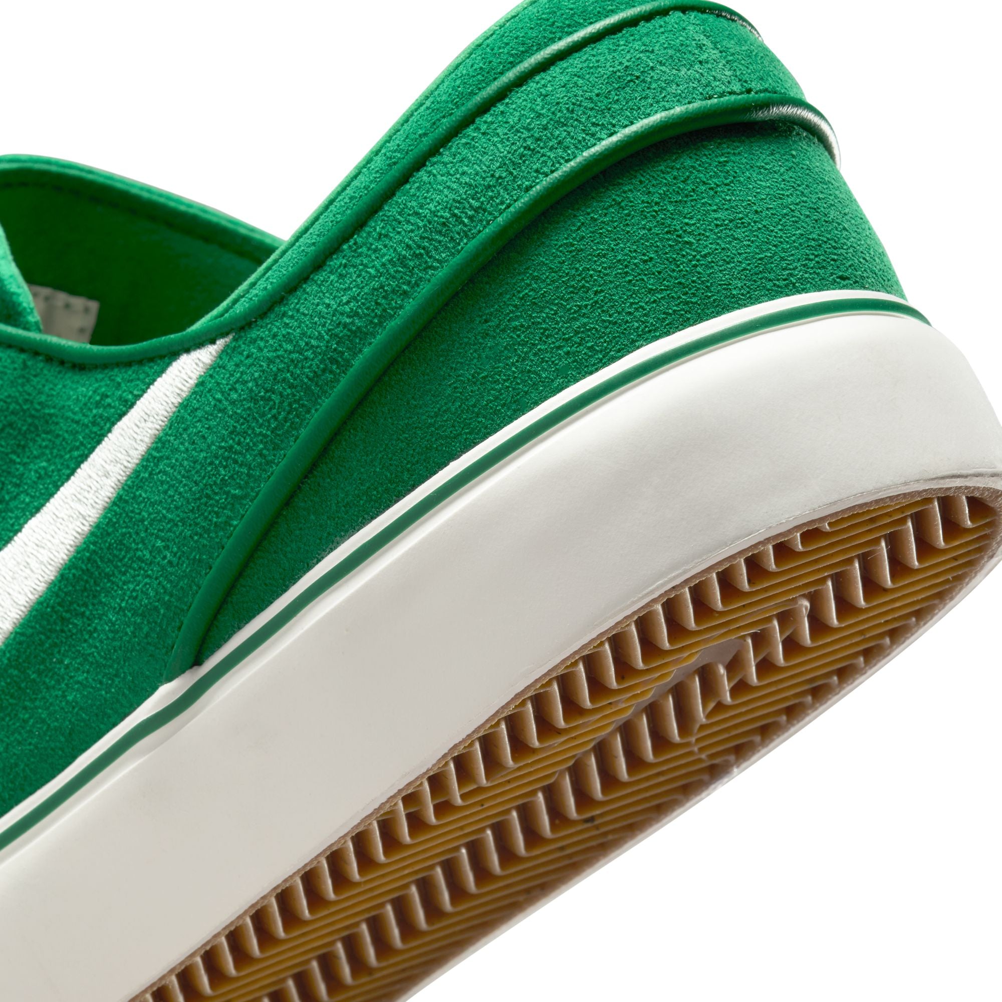 Green nike sb janoski skateboard sneaker with white swoosh logo on a white background