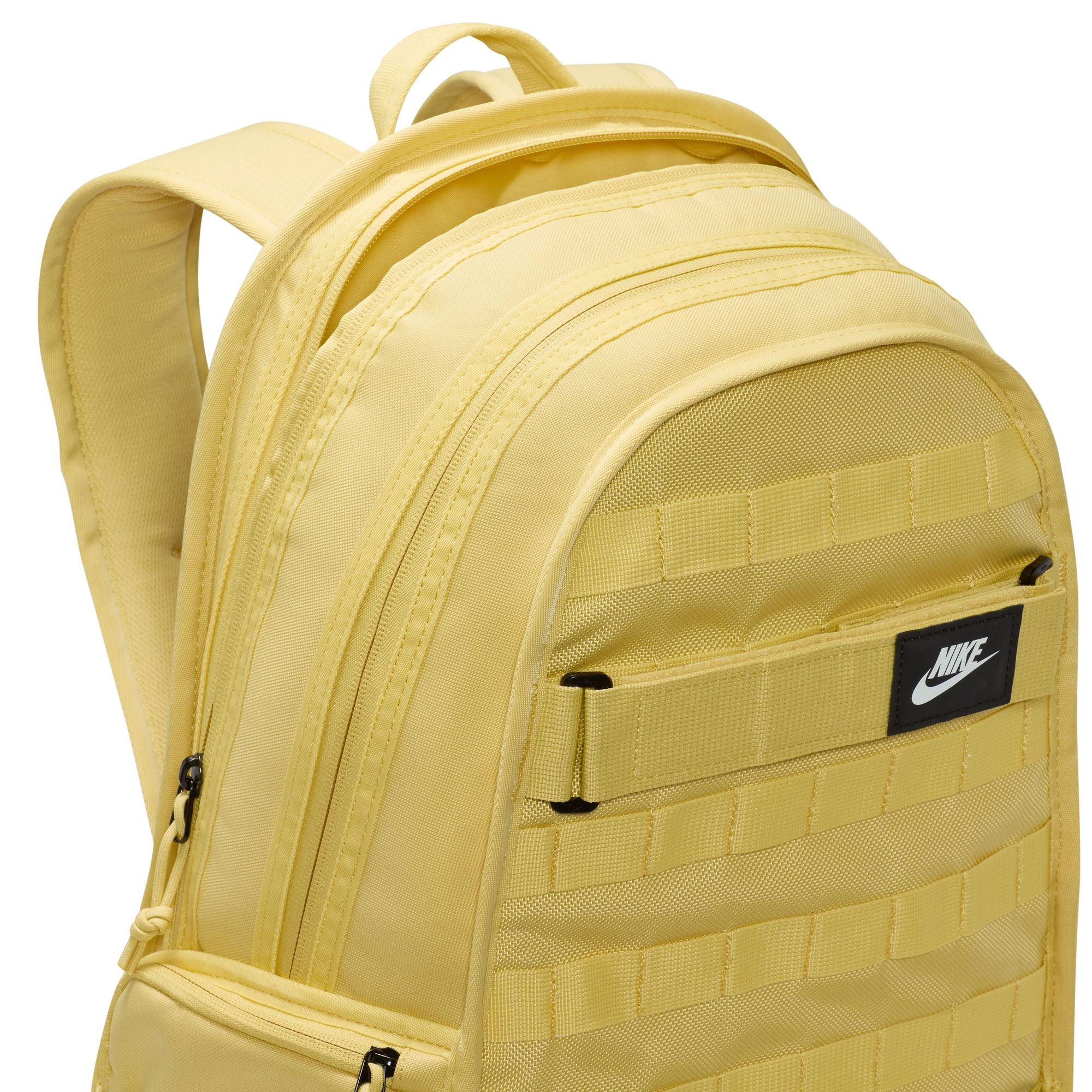 Yellow nike sb prm skate backpack with Nike logo on a white background