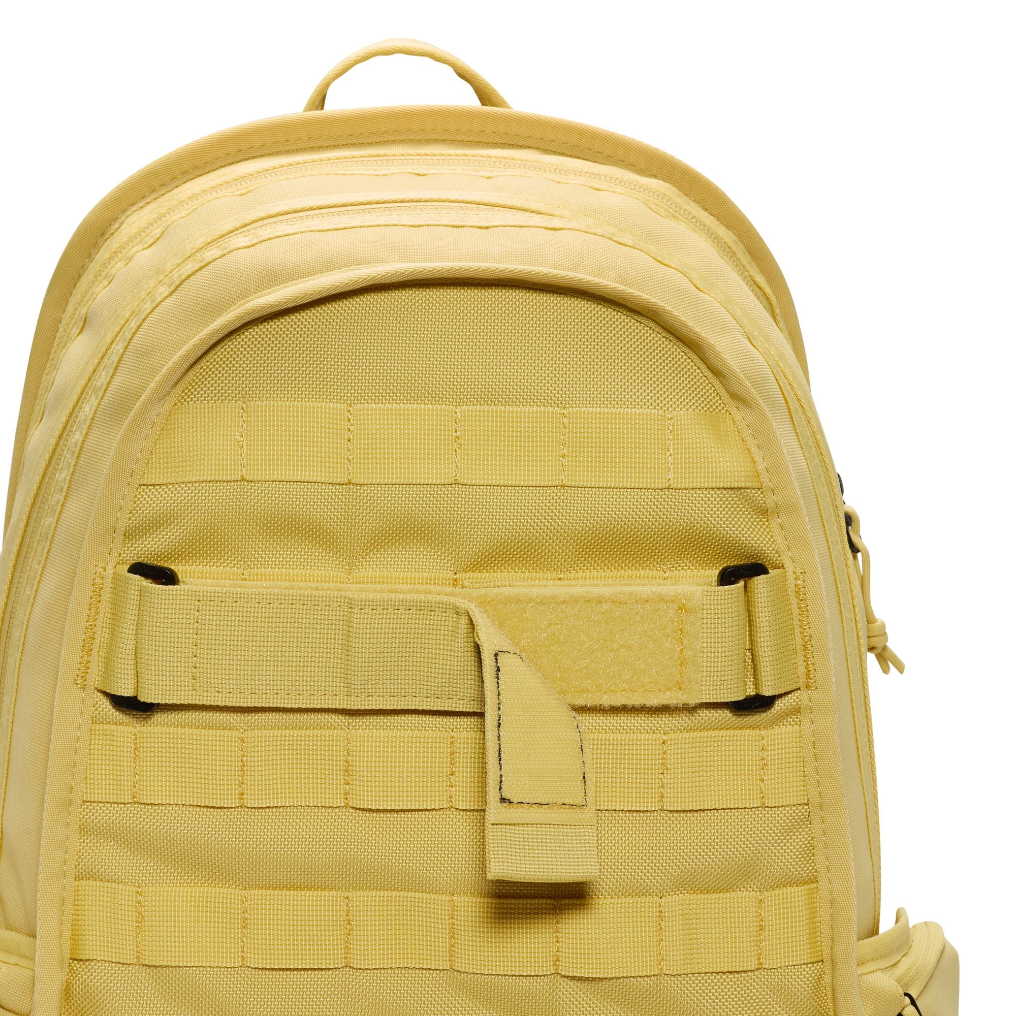 Yellow nike sb prm skate backpack with Nike logo on a white background