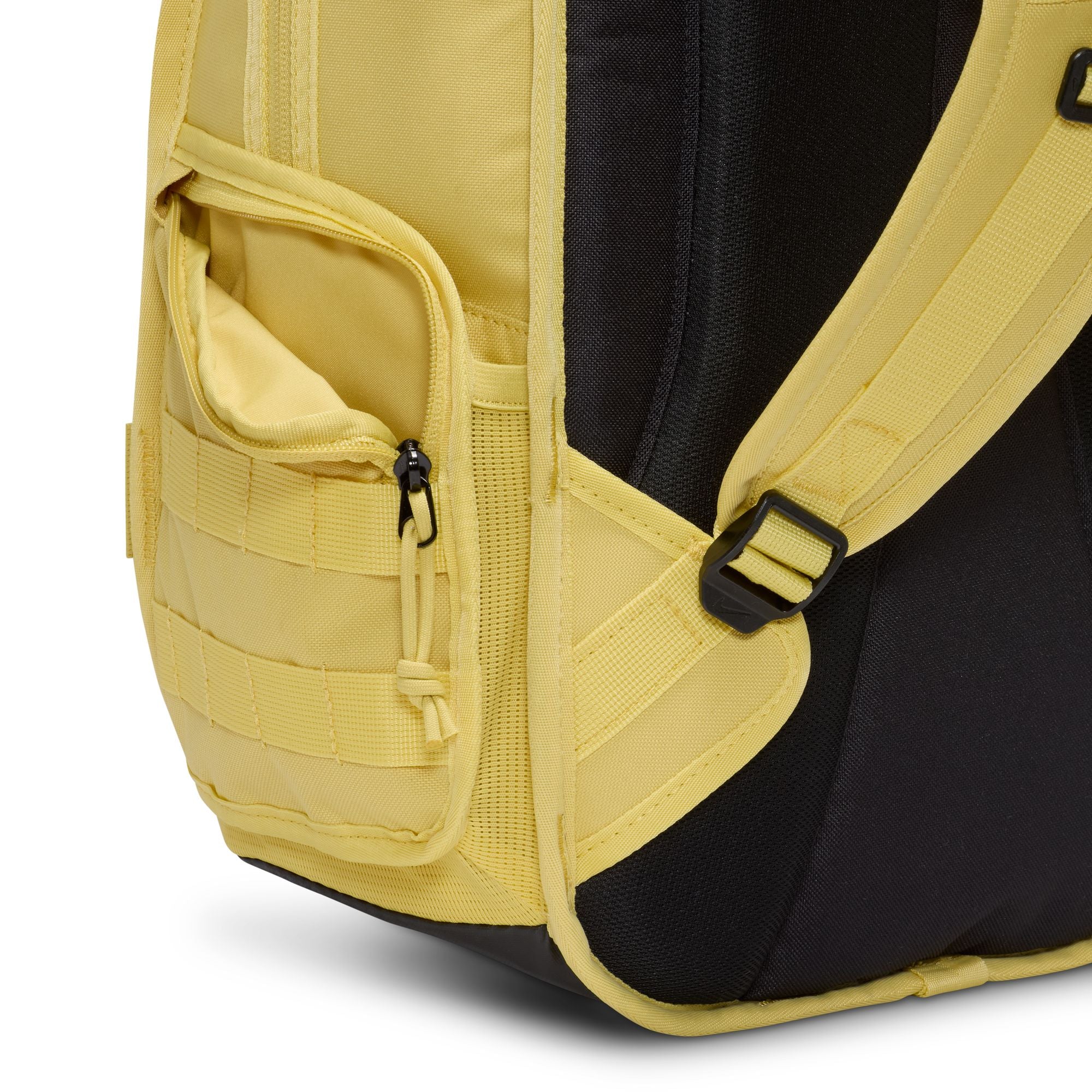 Yellow nike sb prm skate backpack with Nike logo on a white background