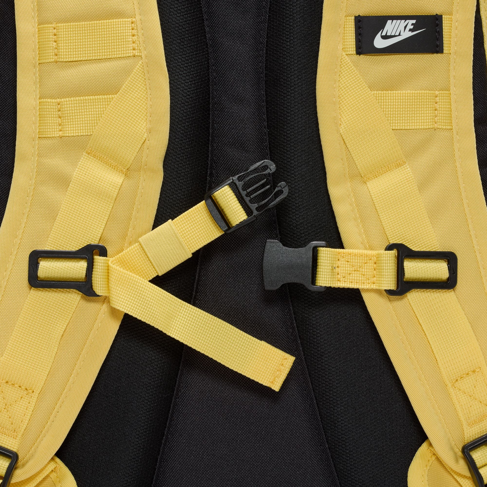 Yellow nike sb prm skate backpack with Nike logo on a white background