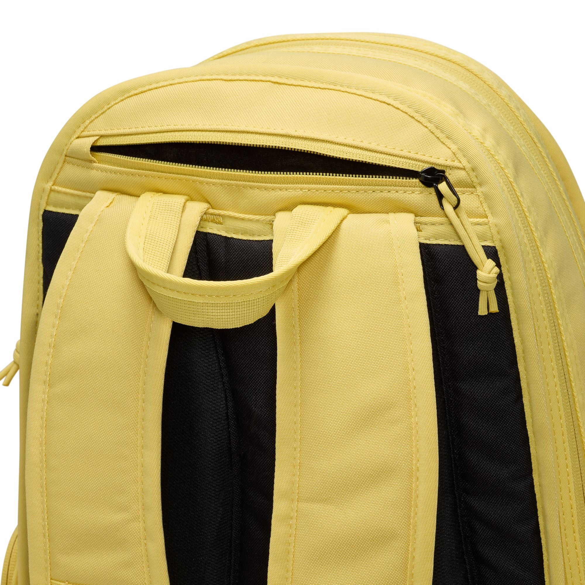 Yellow nike sb prm skate backpack with Nike logo on a white background