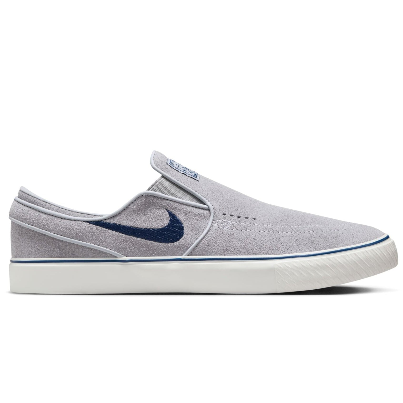 grey men's nike sb janoski slip-on with navy swoosh and white sole