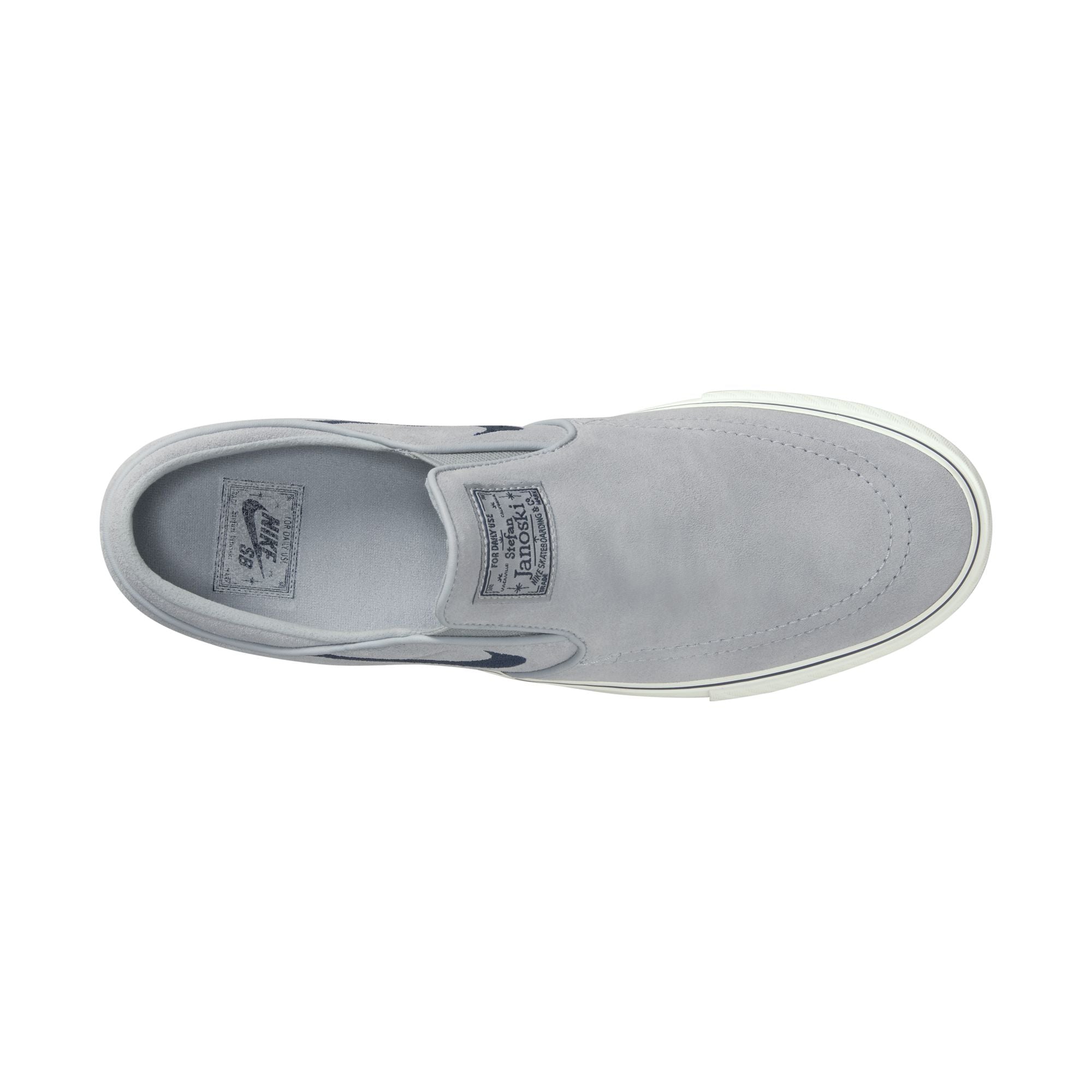 grey men's nike sb janoski slip-on with navy swoosh and white sole