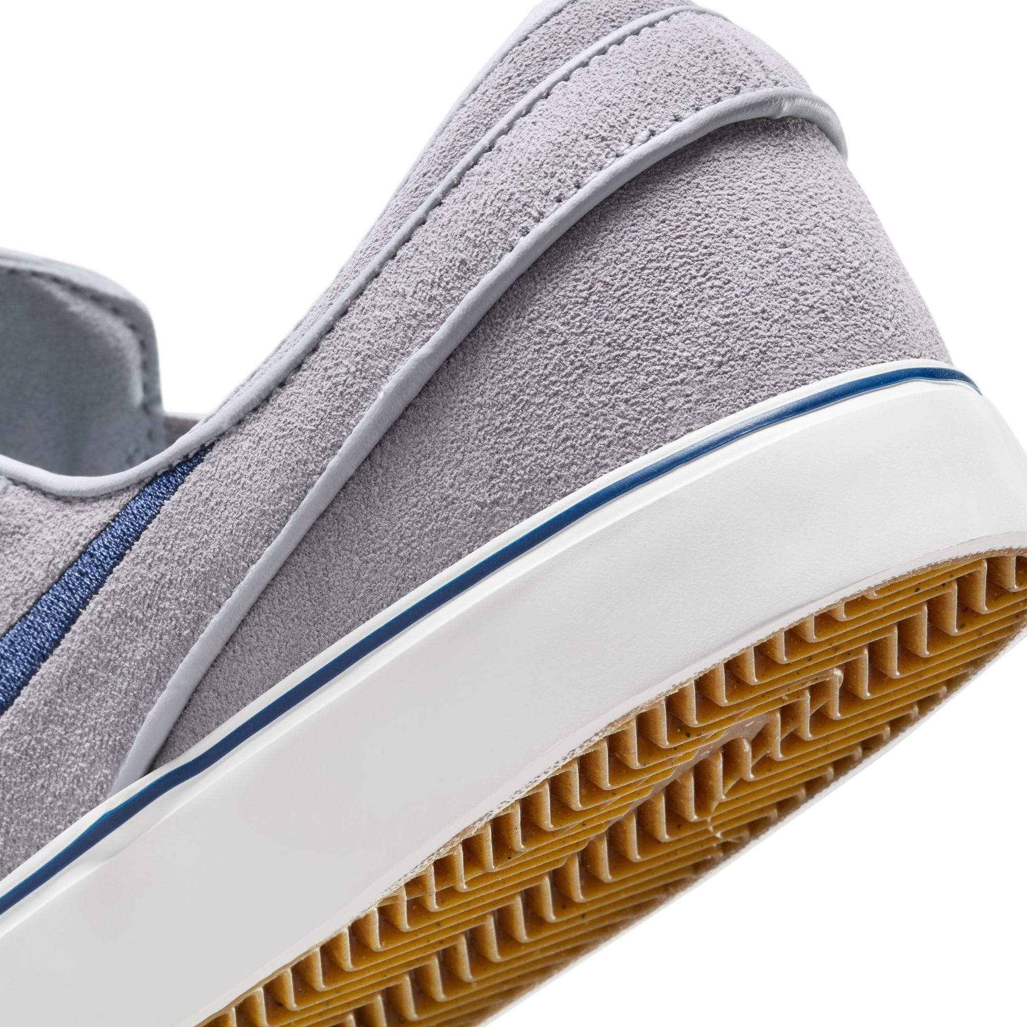 grey men's nike sb janoski slip-on with navy swoosh and white sole