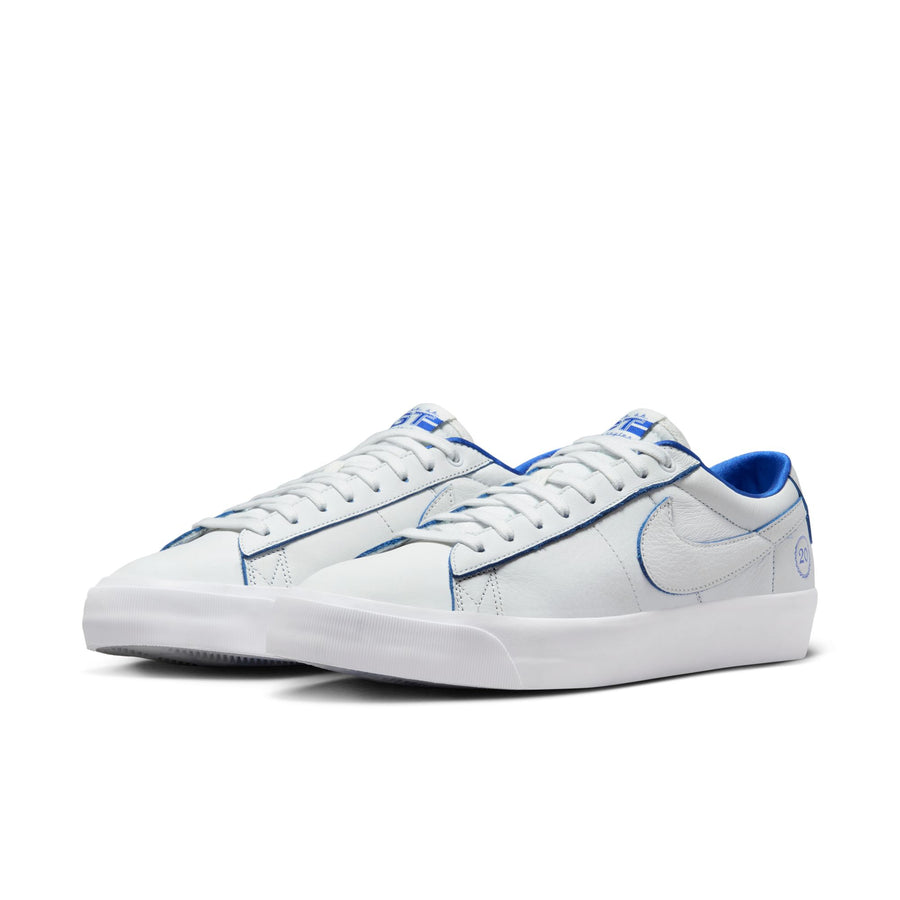 all white nike sb 20th anniversary grant taylor anniversary low top skate shoe with blue undertones and white sole