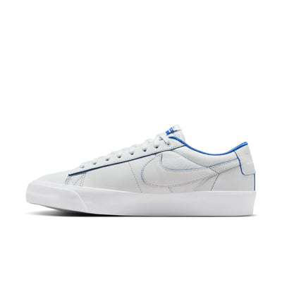 all white nike sb 20th anniversary grant taylor anniversary low top skate shoe with blue undertones and white sole