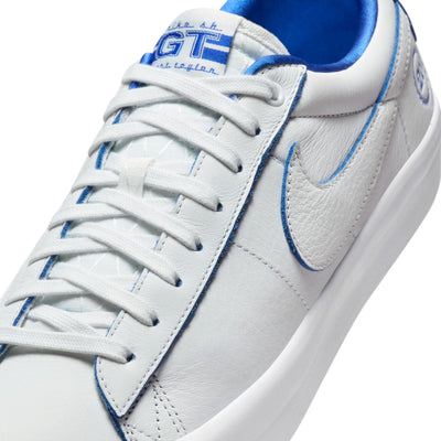 all white nike sb 20th anniversary grant taylor anniversary low top skate shoe with blue undertones and white sole