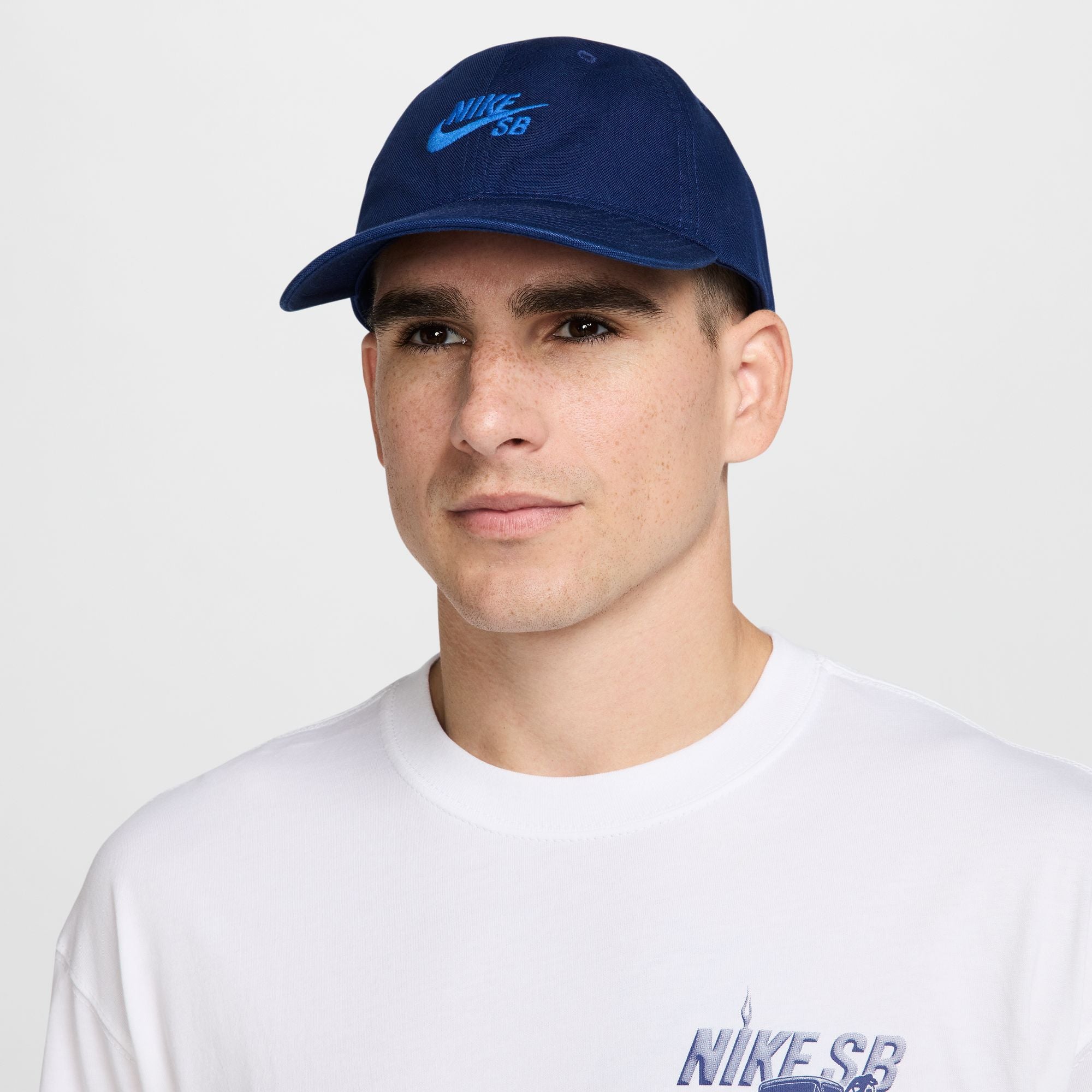 blue nike sb hat with light blue font