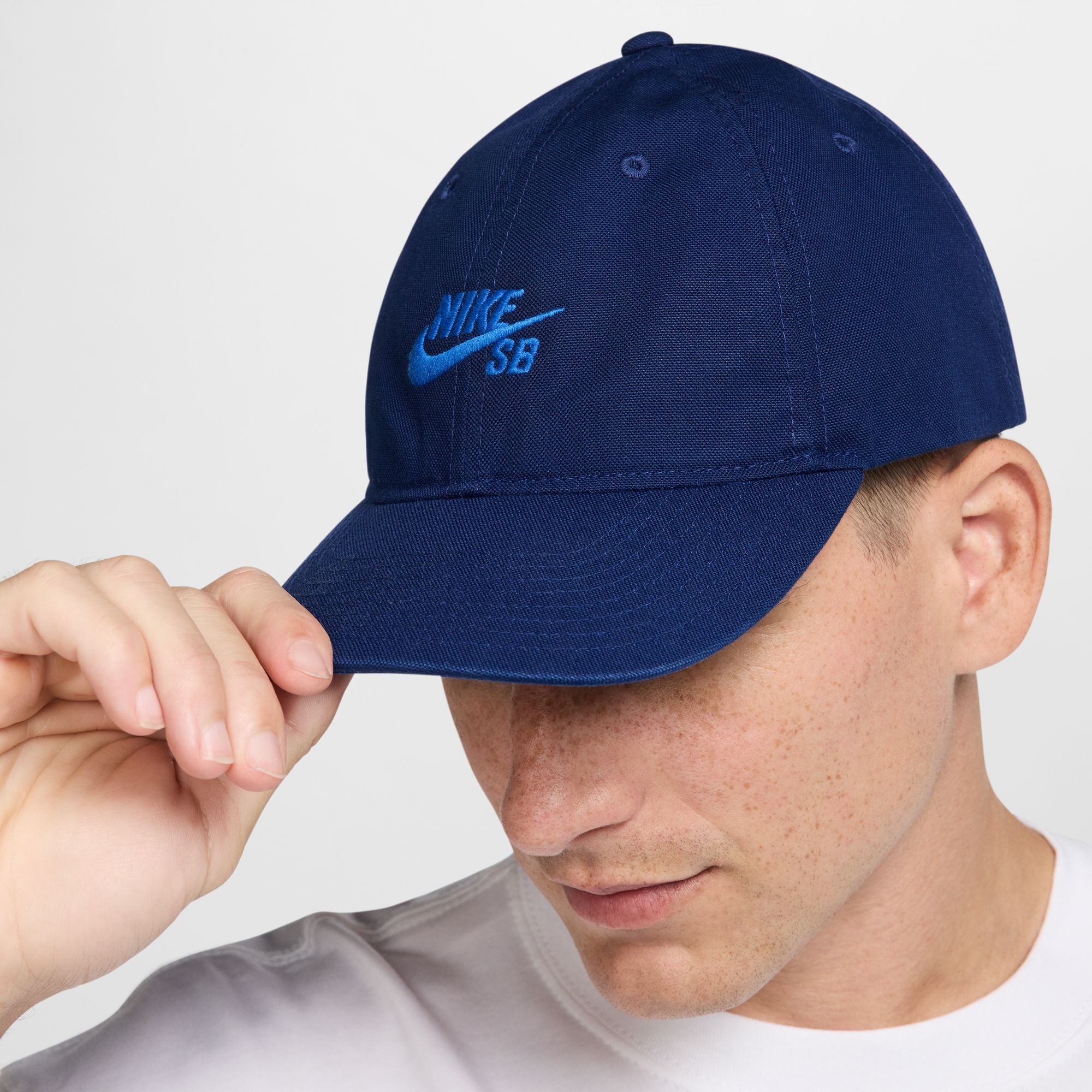blue nike sb hat with light blue font