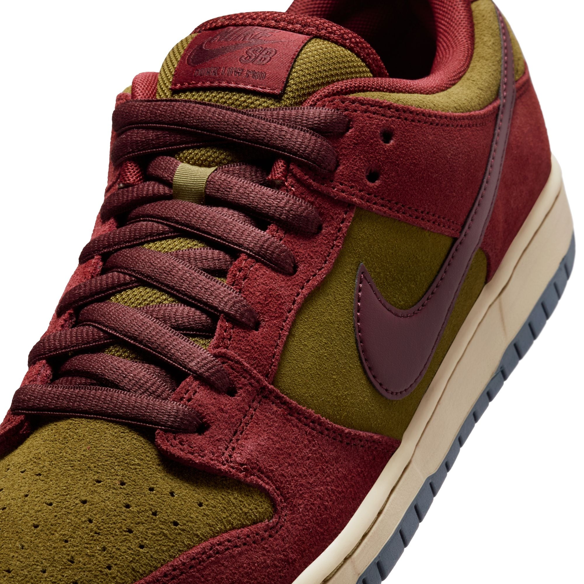 dark team red and olive flak suede nike sb dunk low pro skateboard shoe with off white sole and navy bottom