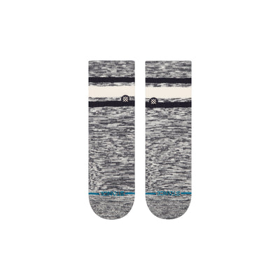 Pair of gray stance socks with white and blue accents on a white background