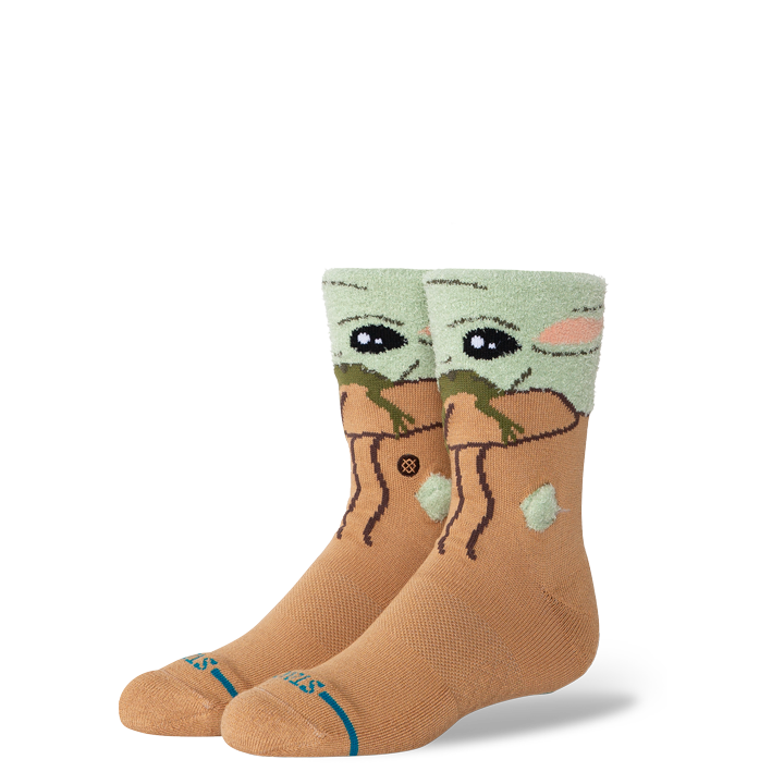 Pair of stance x star wars grogu fuzzy socks with on a white background