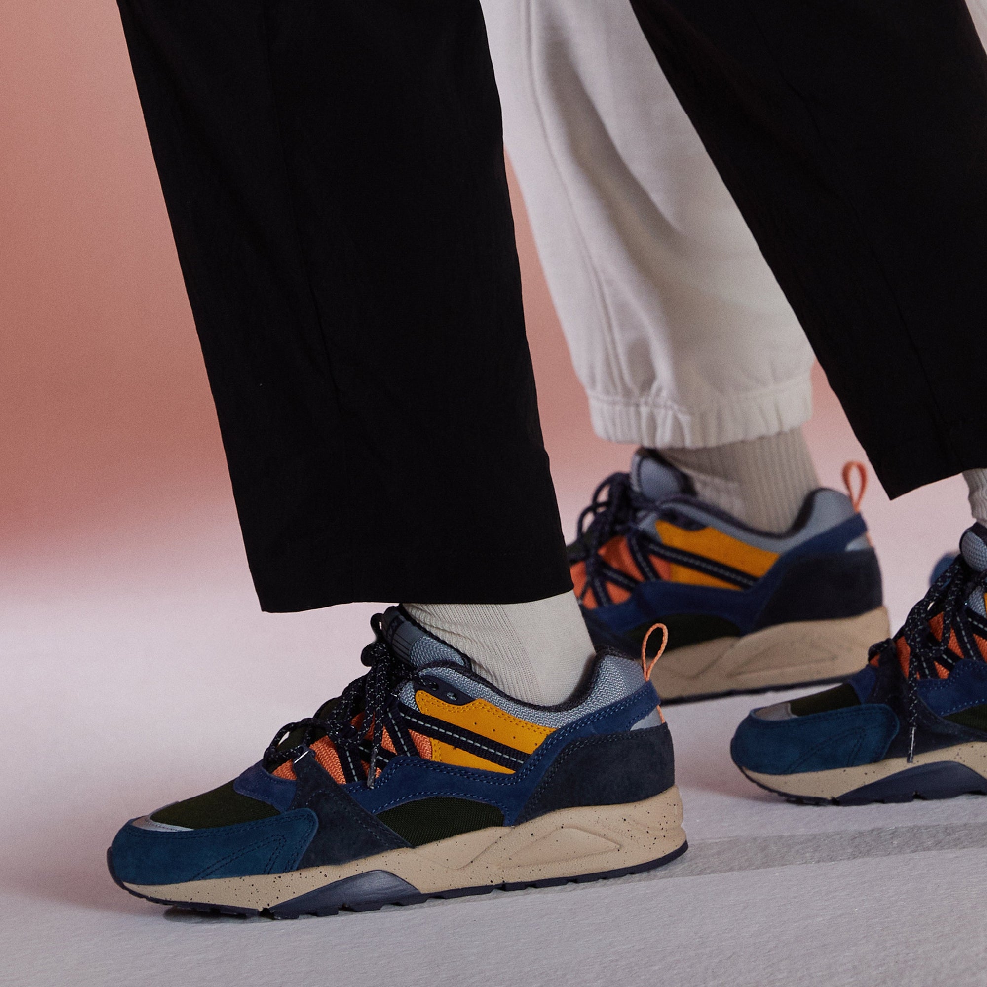 blue karhu men's shoe with green orange and yellow details