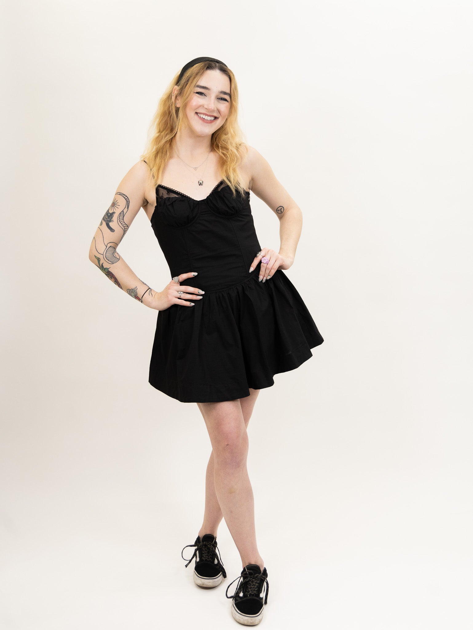 women's black Poplin fit and flare dress featuring a corset bodice and peek-a-boo lace bralette detail from nia