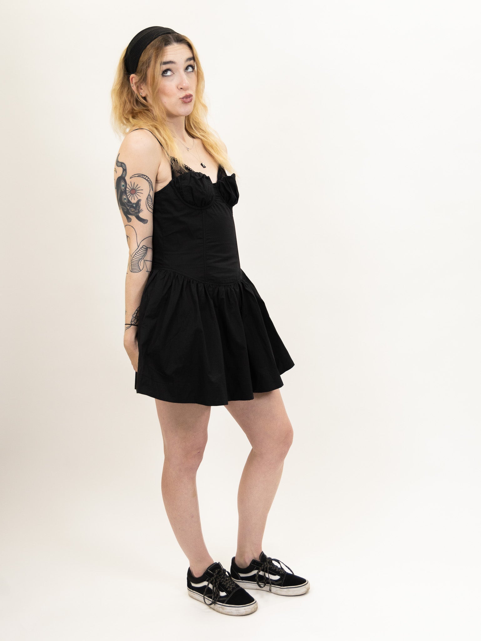 women's black Poplin fit and flare dress featuring a corset bodice and peek-a-boo lace bralette detail from nia