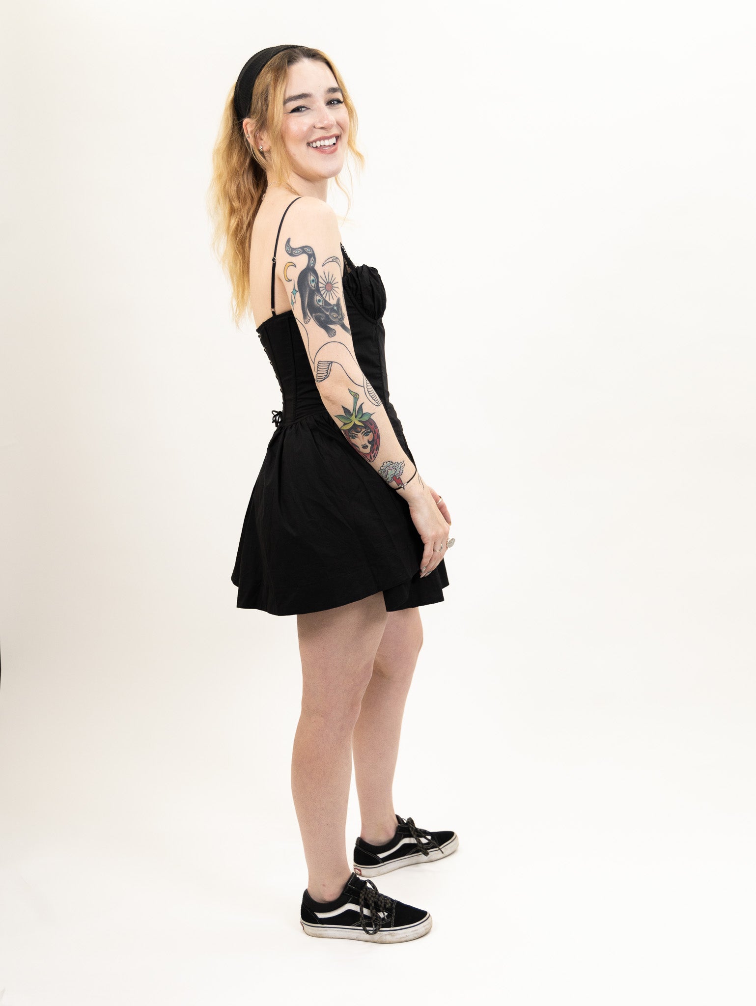 women's black Poplin fit and flare dress featuring a corset bodice and peek-a-boo lace bralette detail from nia