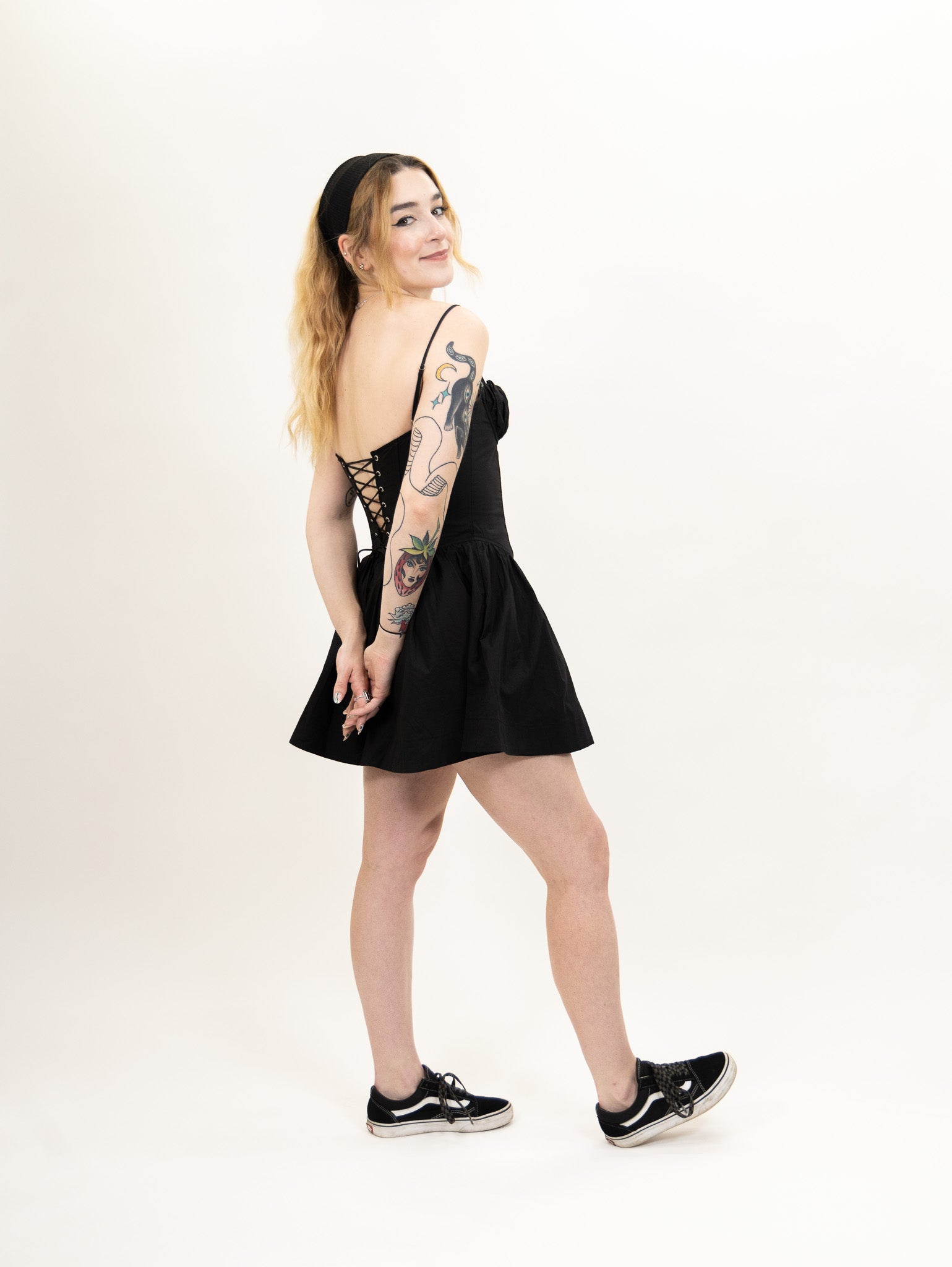 women's black Poplin fit and flare dress featuring a corset bodice and peek-a-boo lace bralette detail from nia