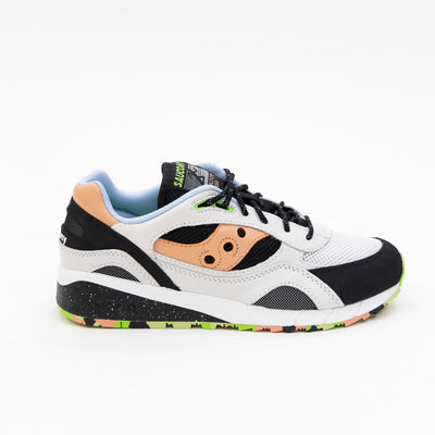 black and white saucony shadow 6000 men's comfort shoe with orange detail and a white and black sole with multi colored bottom