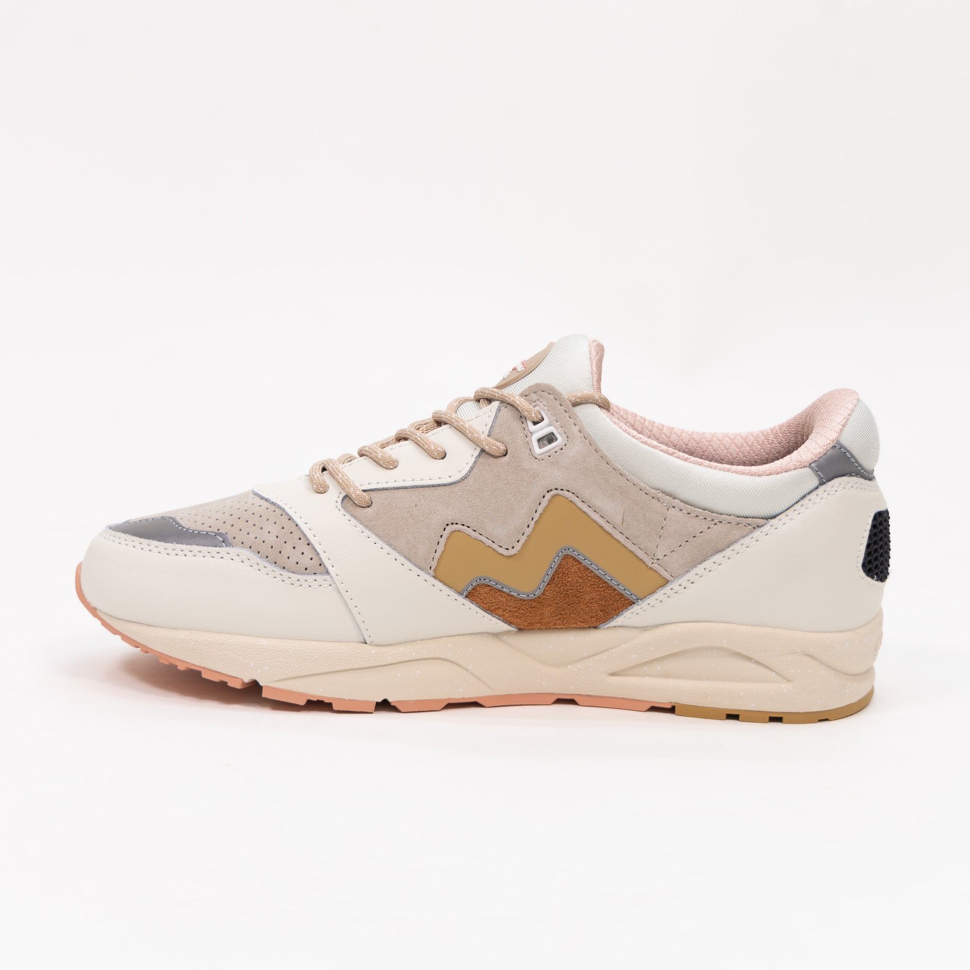 off white karhu women's comfort shoe with gold and orange detail